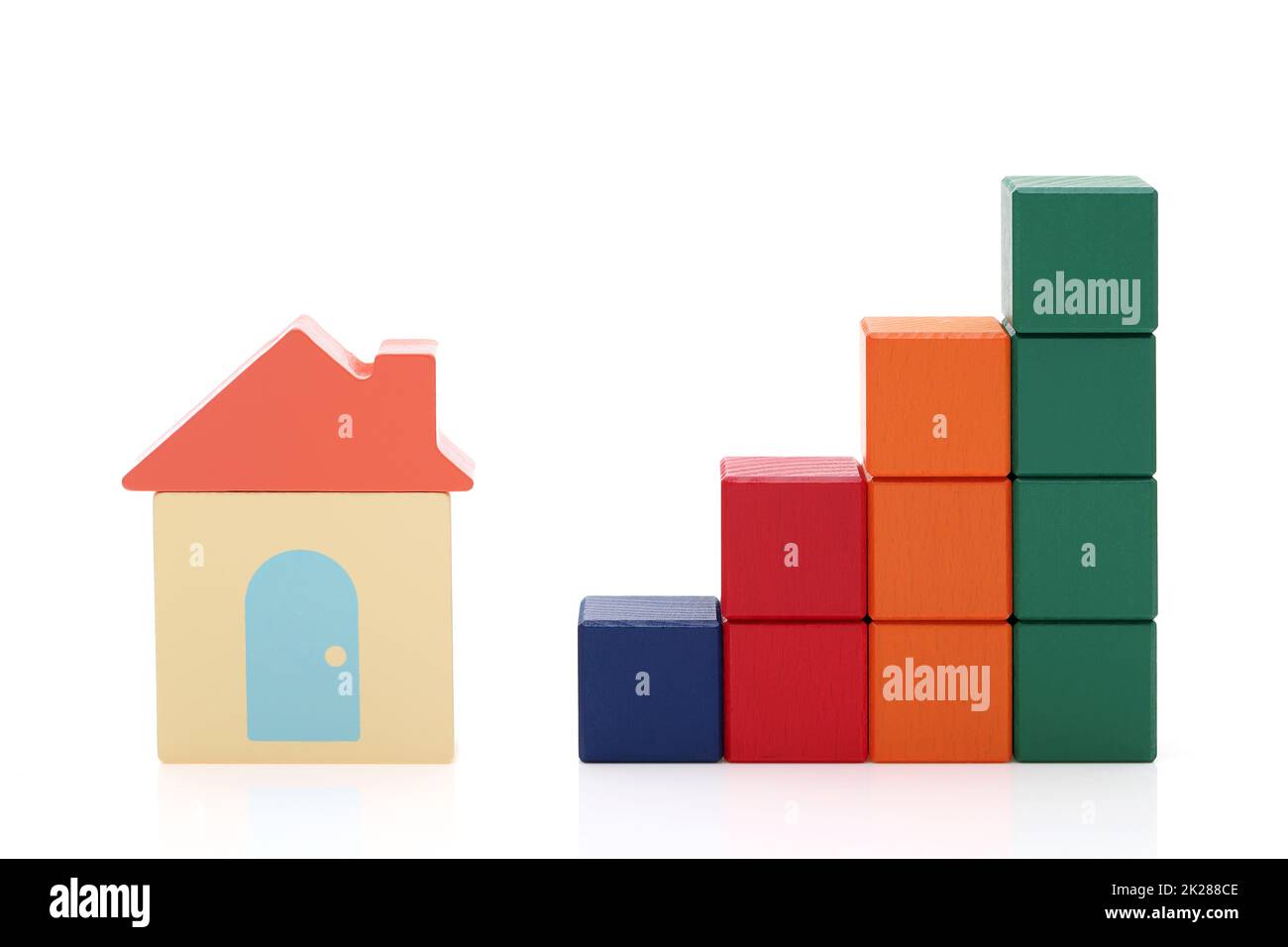 small toy house and wooden colorful building blocks on white background Stock Photo