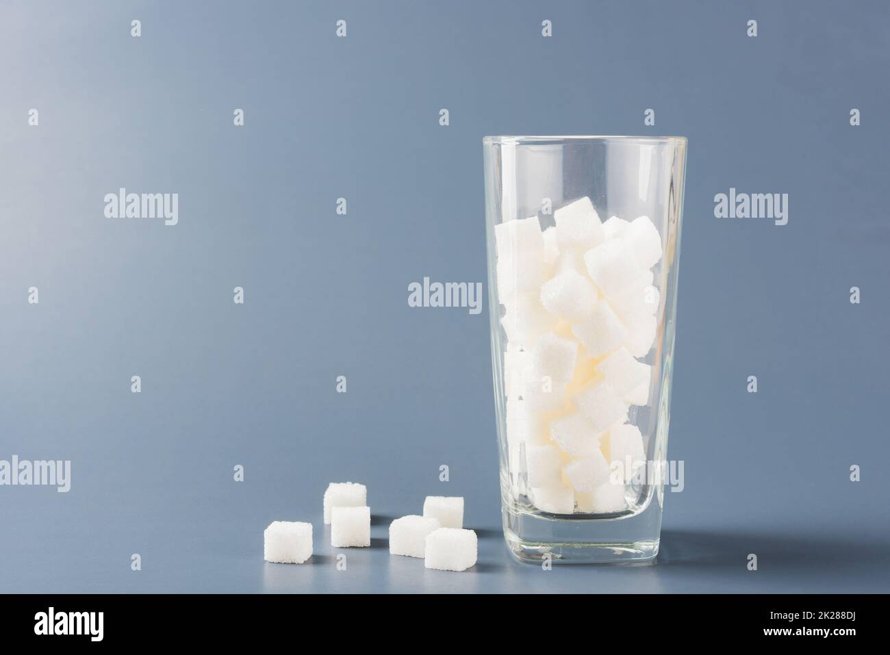 glass full of white sugar cube sweet food Stock Photo