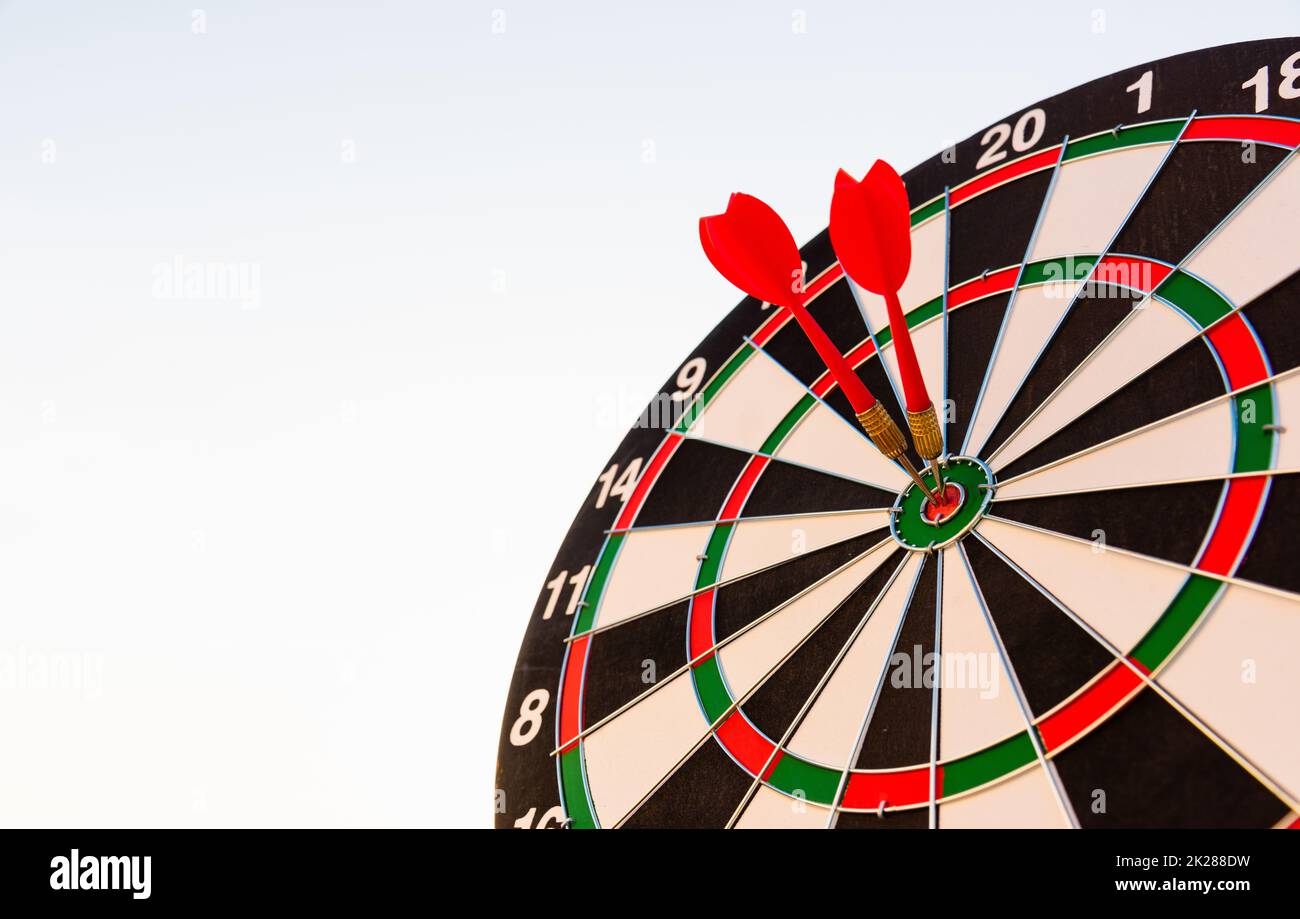 Dart arrow hit center on bullseye dartboard is target Stock Photo