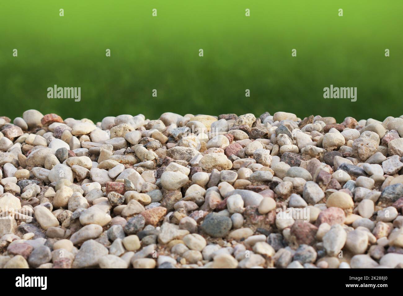 A pile of stones against the background of grass Stock Photo