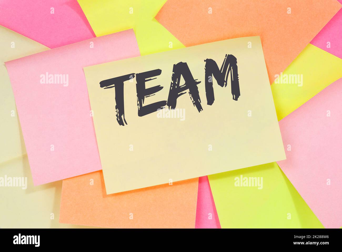 Team teamwork working together business concept office note paper Stock Photo