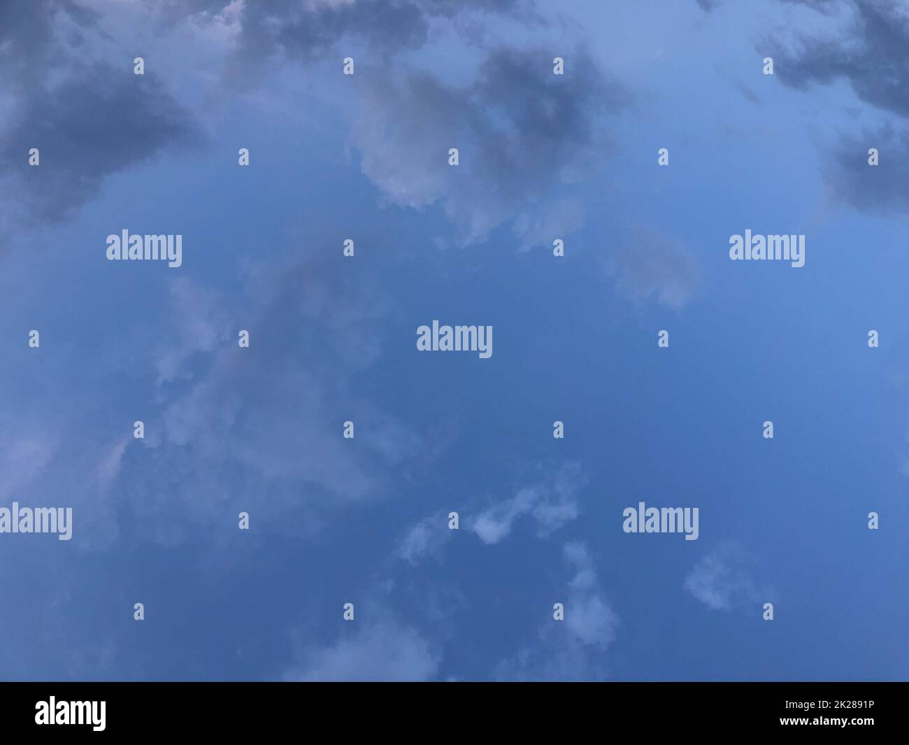 Fluffy white clouds and blue sky Stock Photo - Alamy