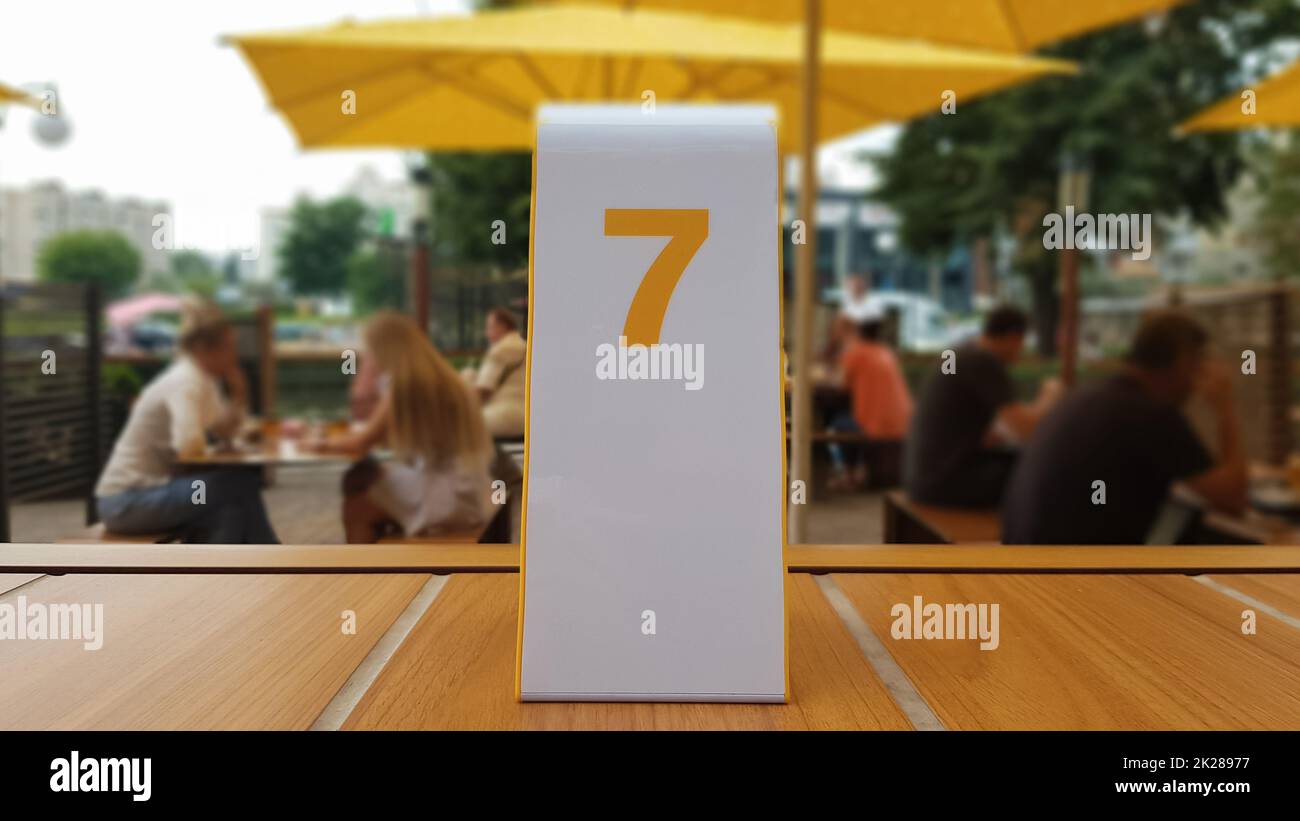 the order number on the table on the street in a McDonald's restaurant. Awaiting an order at a McDonald's restaurant. Fast food with invoice, check. Ukraine, Kiev - September 6, 2019. Stock Photo