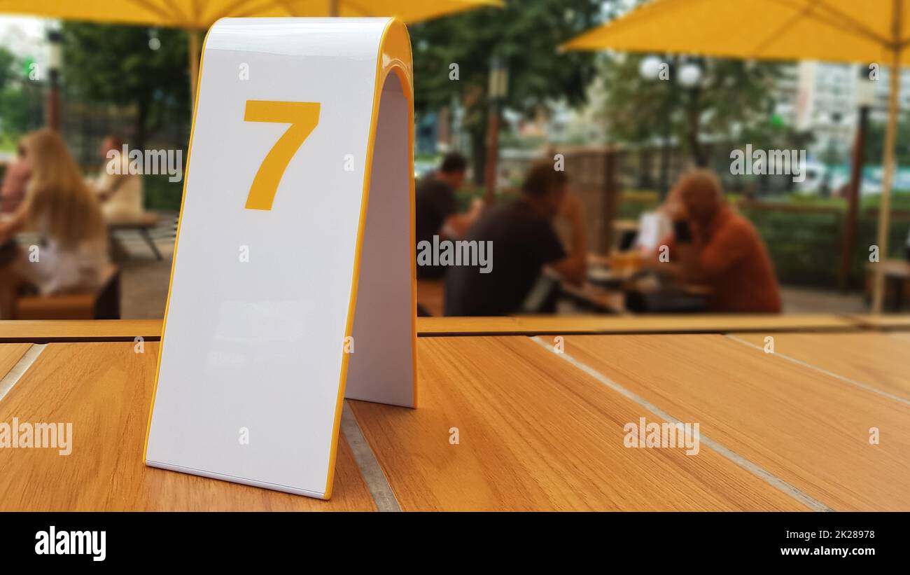 the order number on the table on the street in a McDonald's restaurant. Awaiting an order at a McDonald's restaurant. Fast food with invoice, check. Ukraine, Kiev - September 6, 2019. Stock Photo