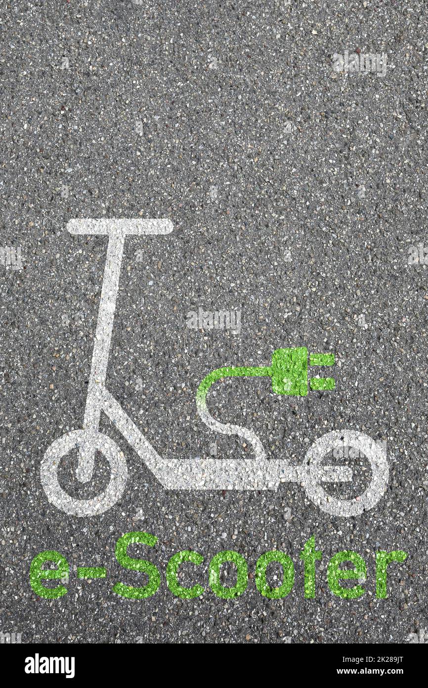 Electric scooter e-scooter road sign eco friendly portrait format green mobility city transport Stock Photo