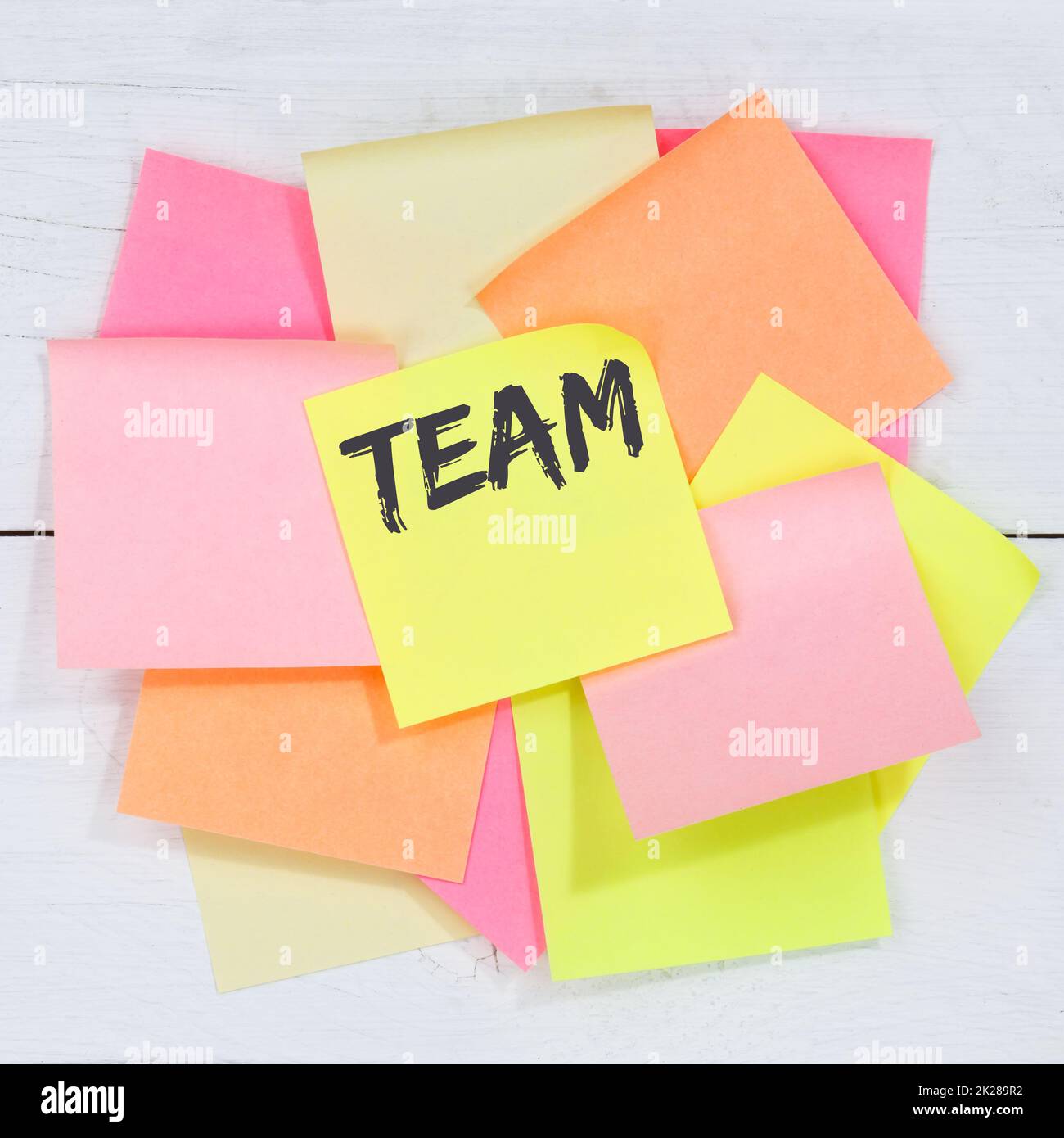 Team teamwork working together business concept desk note paper Stock Photo
