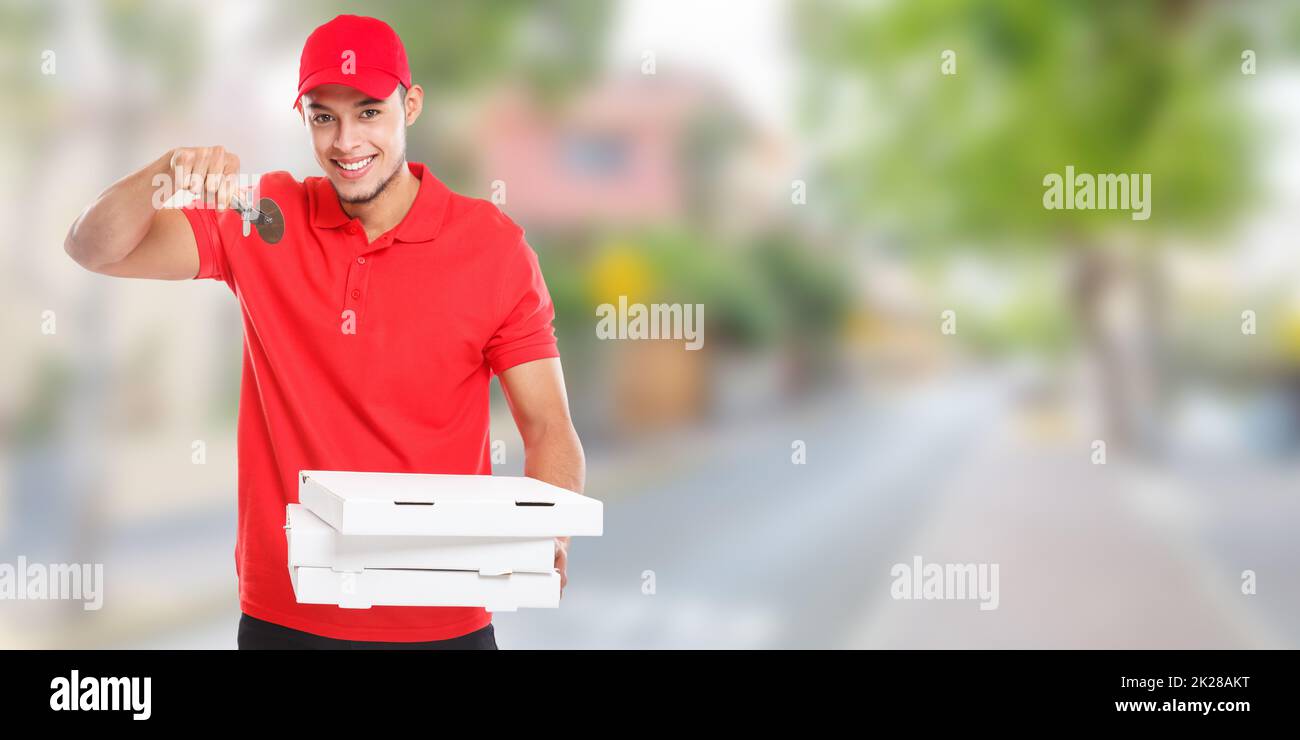Pizza cutter fast food delivery smiling young latin man town banner copyspace copy space delivering deliver Stock Photo