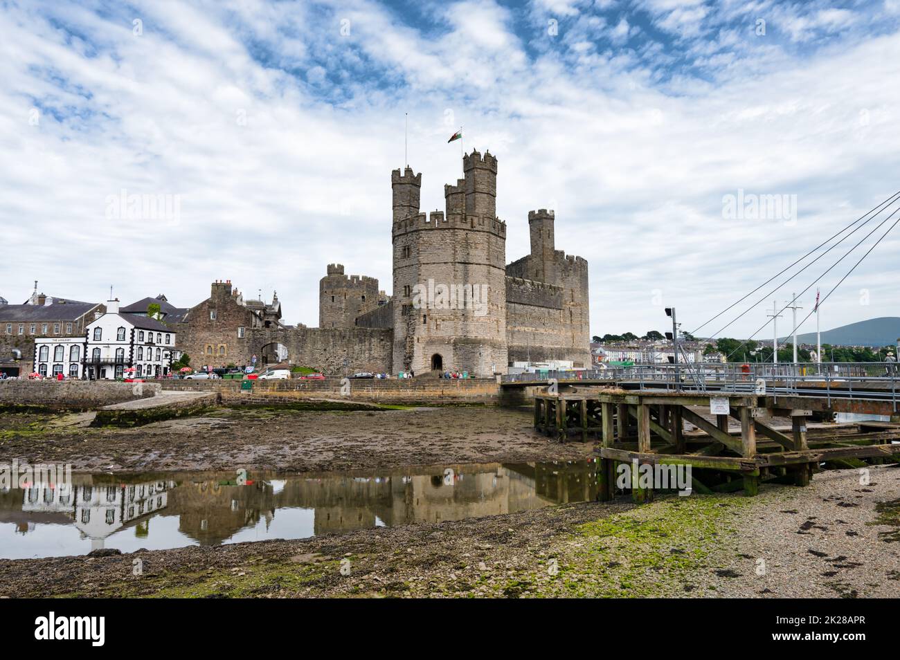 Caernarfon, UK- July 11, 2022: Caernarfon Castle and the swing bridge  in North Wales. Stock Photo