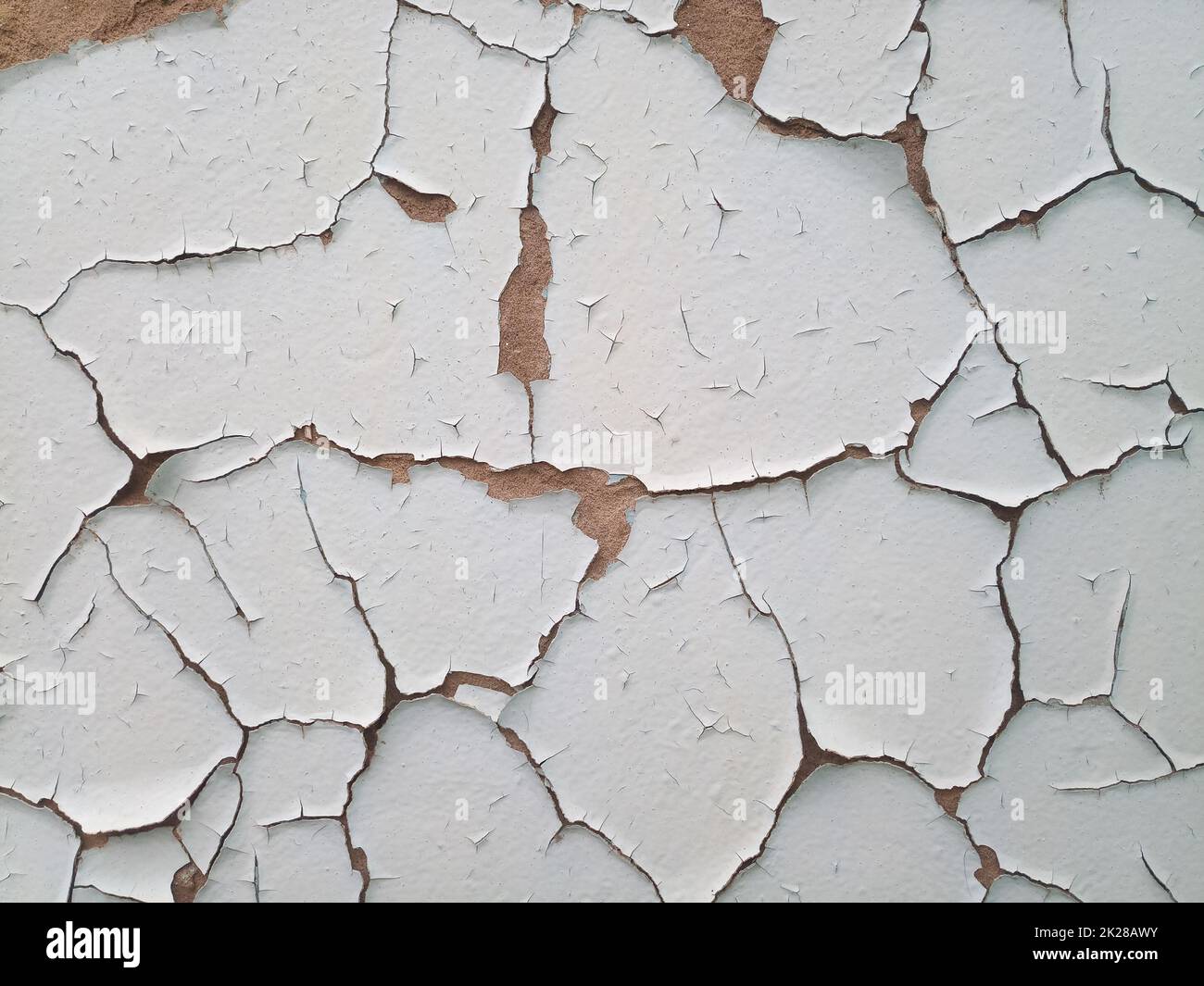 Background texture wall with peeling paint. Peeling old paint wall. Stock Photo