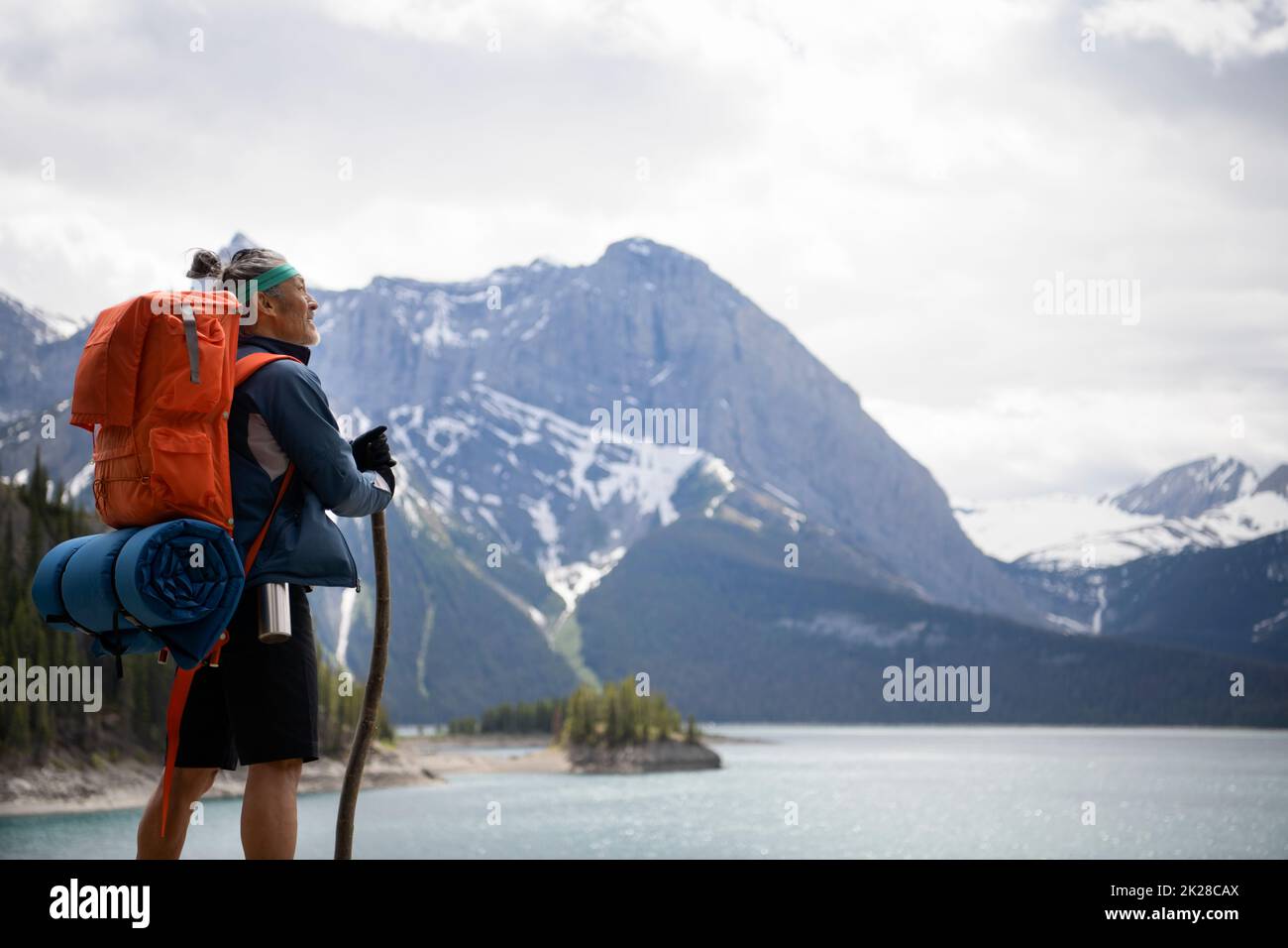 Hiker looking at mountain view hi-res stock photography and images - Alamy