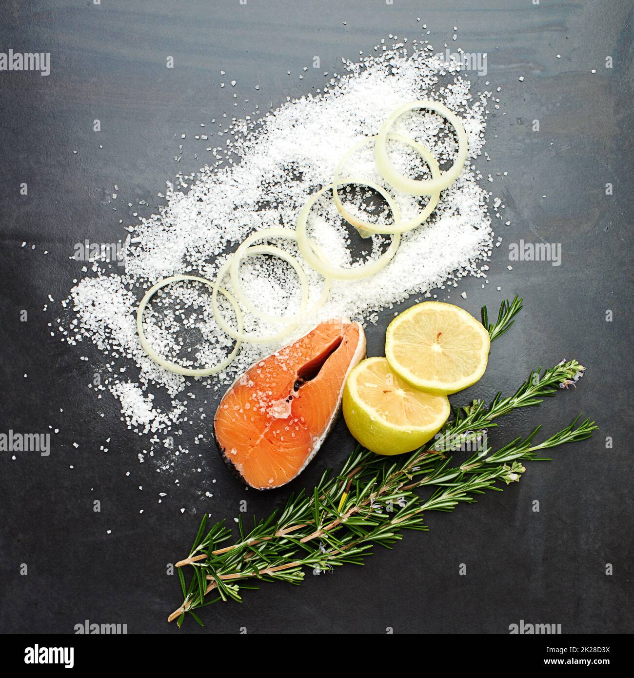 Now that looks delicious. High angle studio shot of delicious fish herbs on a table. Stock Photo