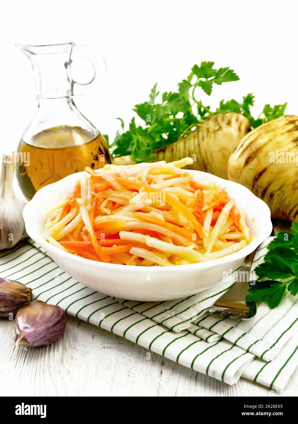 Salad of parsnip and carrot on table Stock Photo