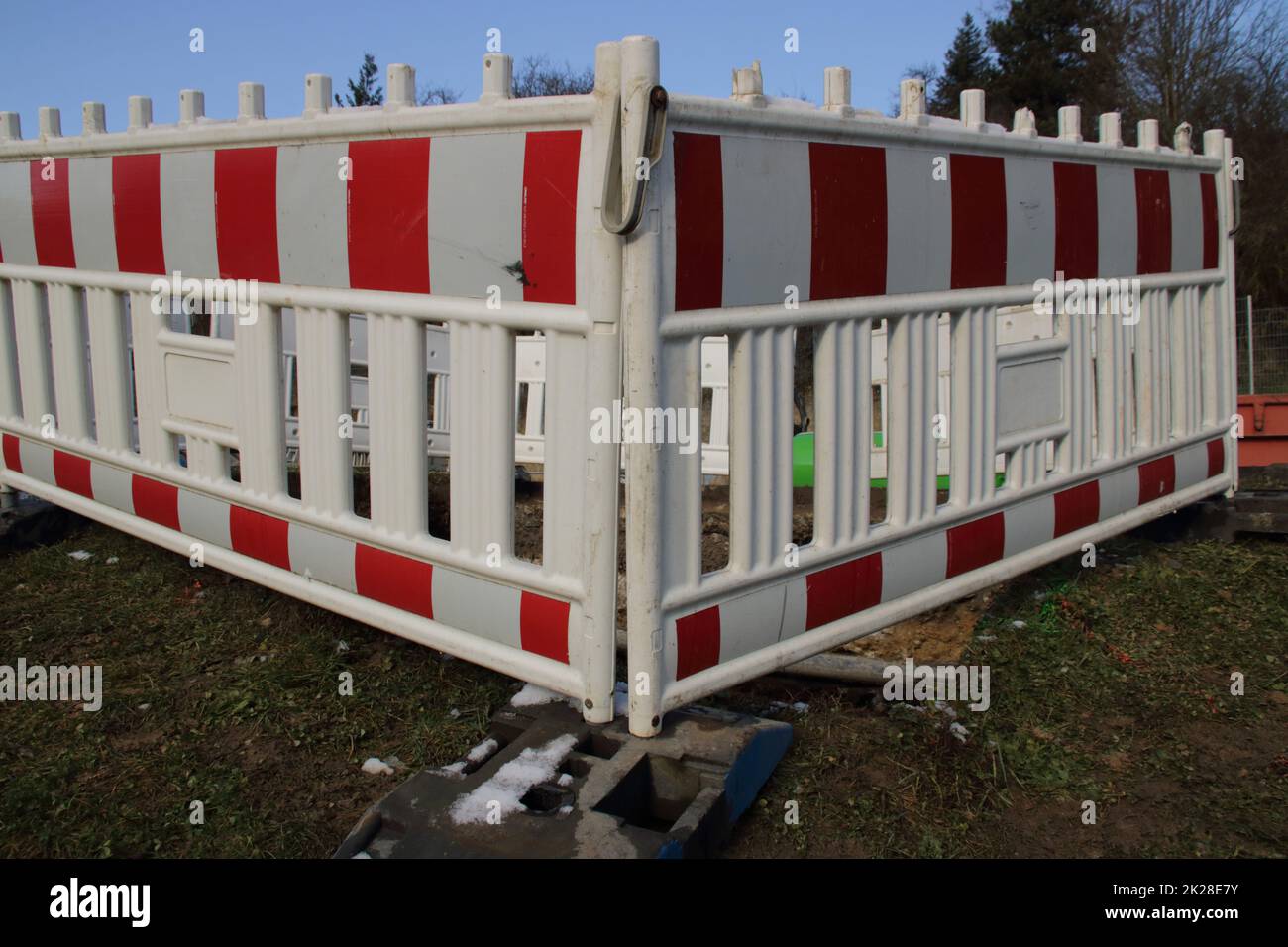 Construction site is secured with barrier material Stock Photo - Alamy