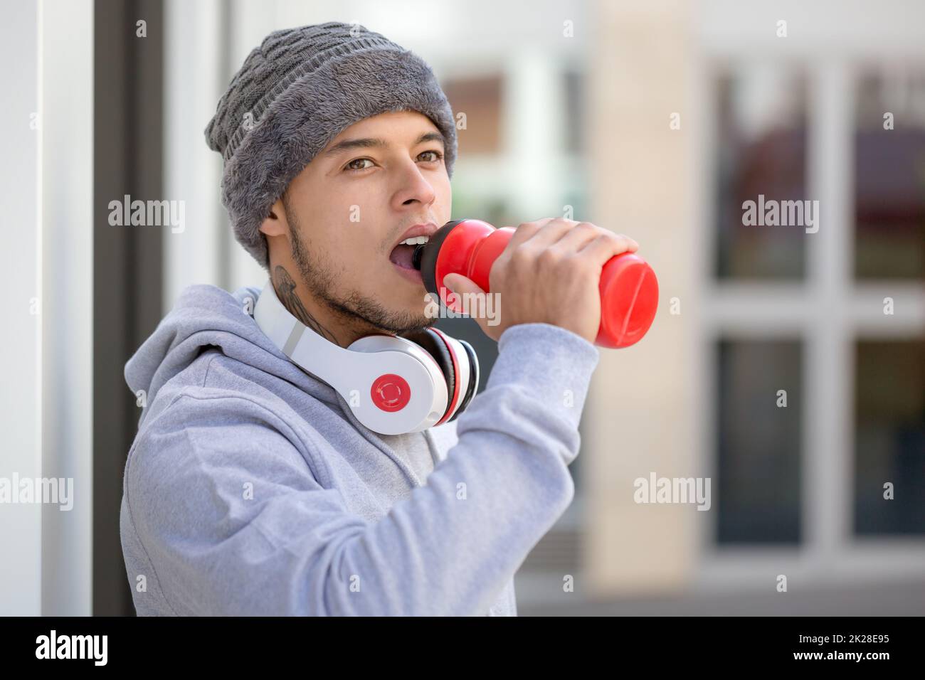 Drinking water young man runner copyspace copy space winter cold sports training fitness Stock Photo