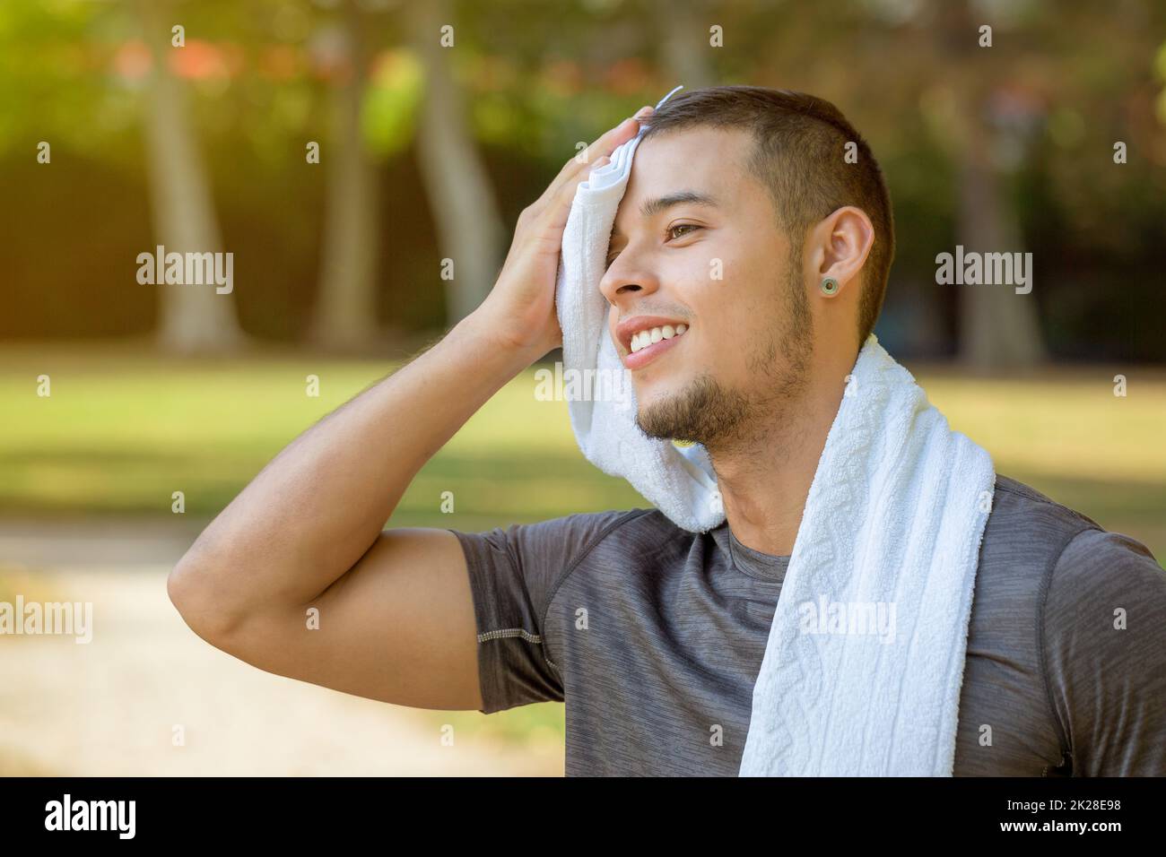 Break during running jogging sports training young man fitness workout Stock Photo