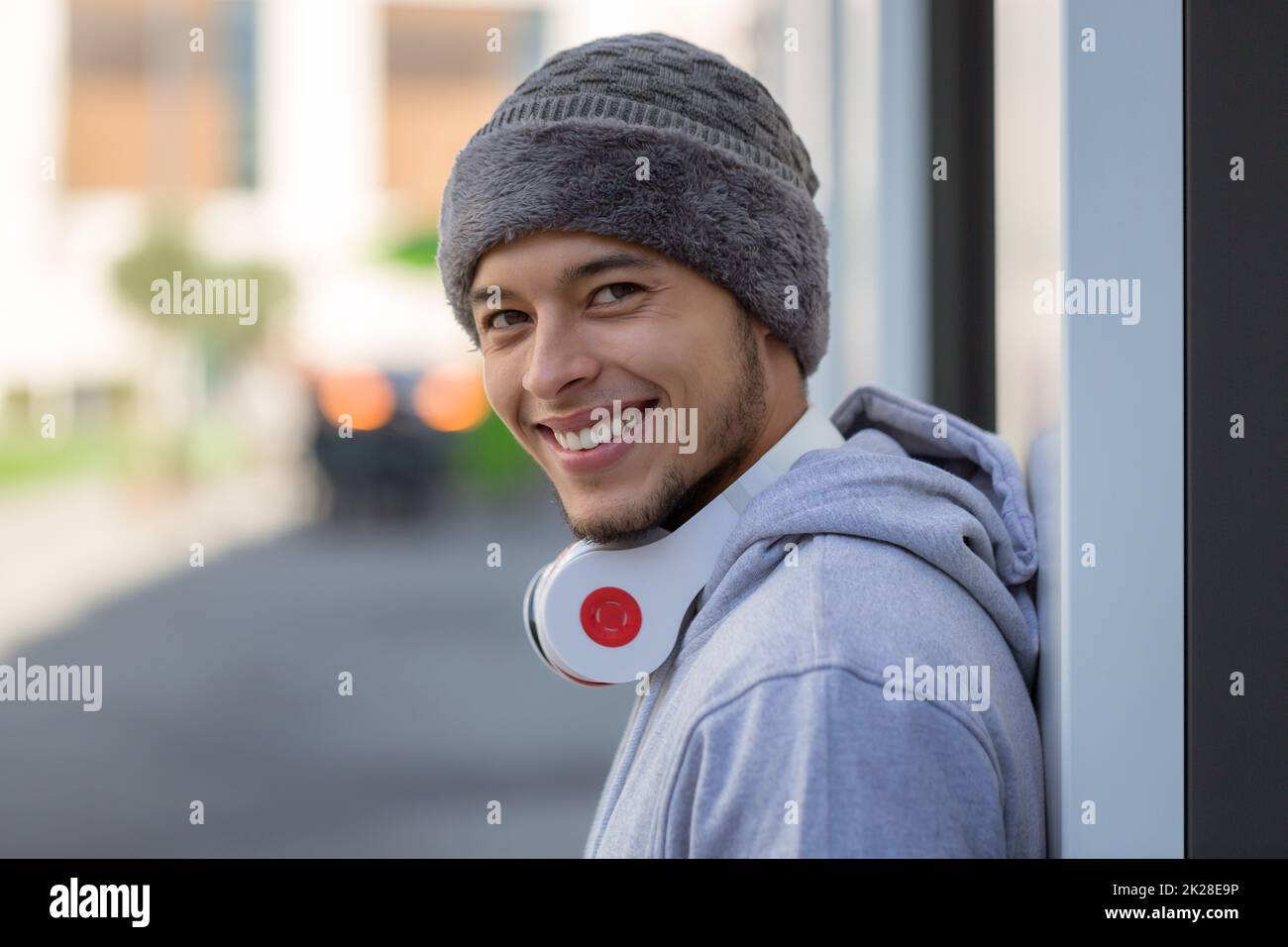 Sports training smiling young latin man runner looking into camera copyspace copy space Stock Photo