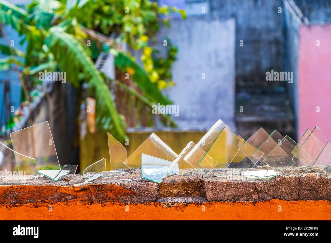 Dangerous wall with broken glass shards Playa del Carmen Mexico Stock