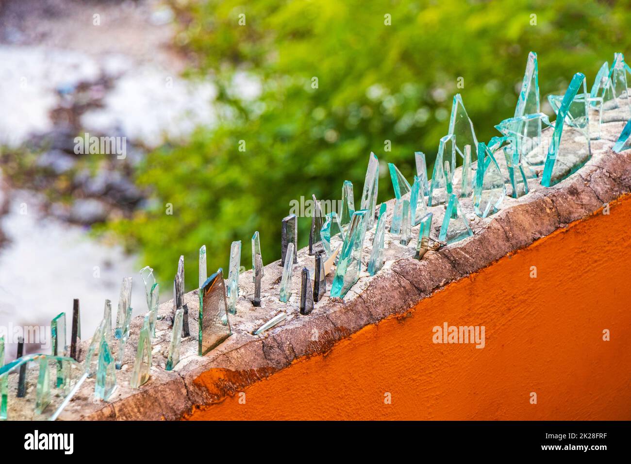 Dangerous wall with broken glass shards Playa del Carmen Mexico Stock