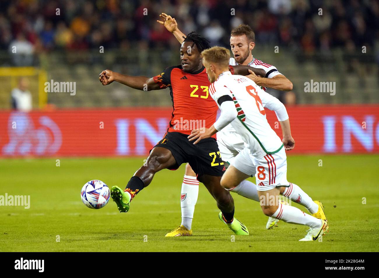 Belgium's Michy Batshuayi (left) battles for the ball with Wales' Matthew Smith and Rhys Norrington-Davies during the UEFA Nations League Group D Match at King Baudouin Stadium, Brussels. Picture date: Thursday September 22, 2022. Stock Photo