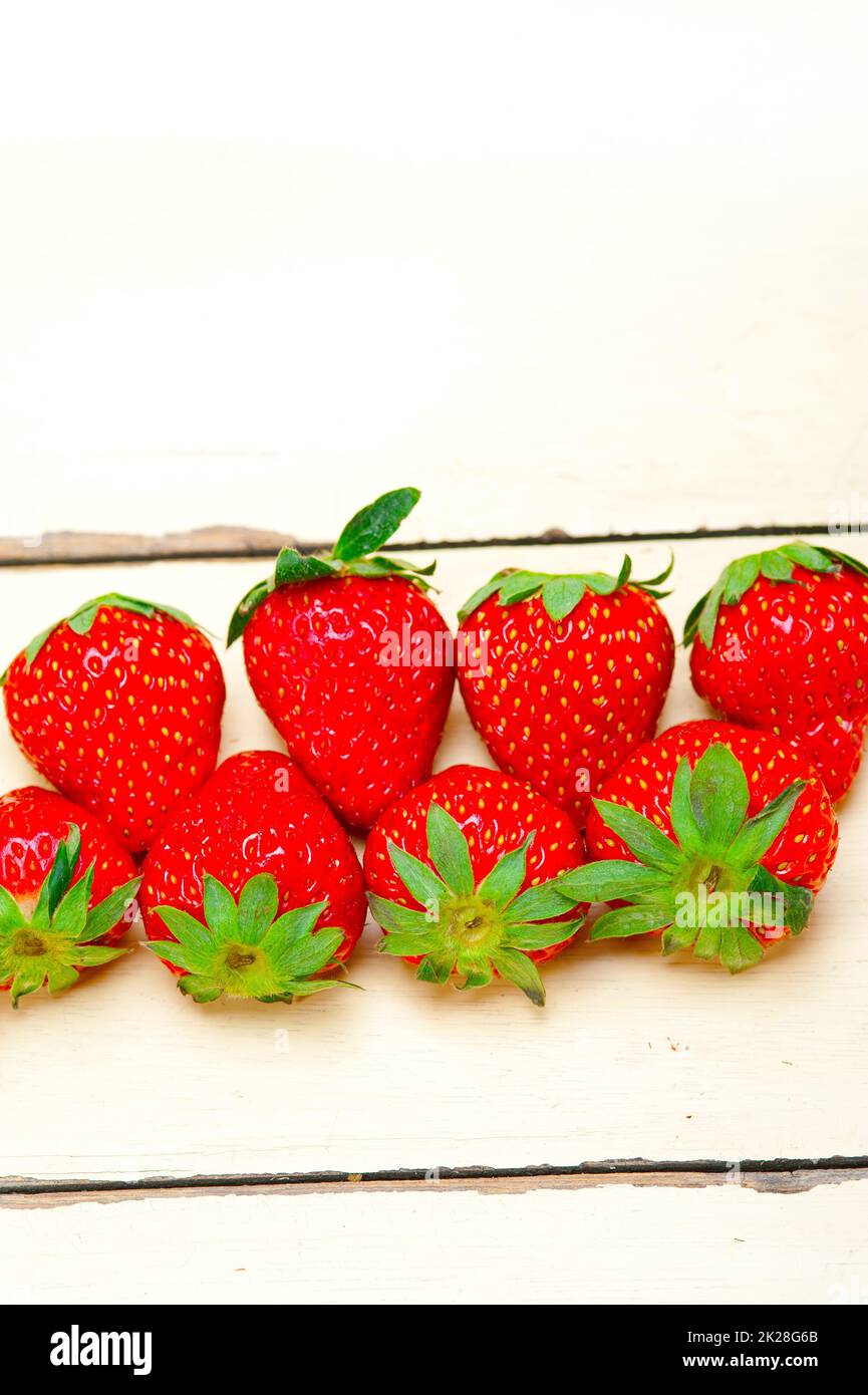 fresh organic strawberry over white wood Stock Photo - Alamy