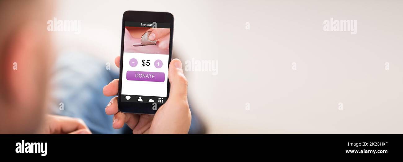 Money Donation Using Mobile Phone. Contribute Online Stock Photo