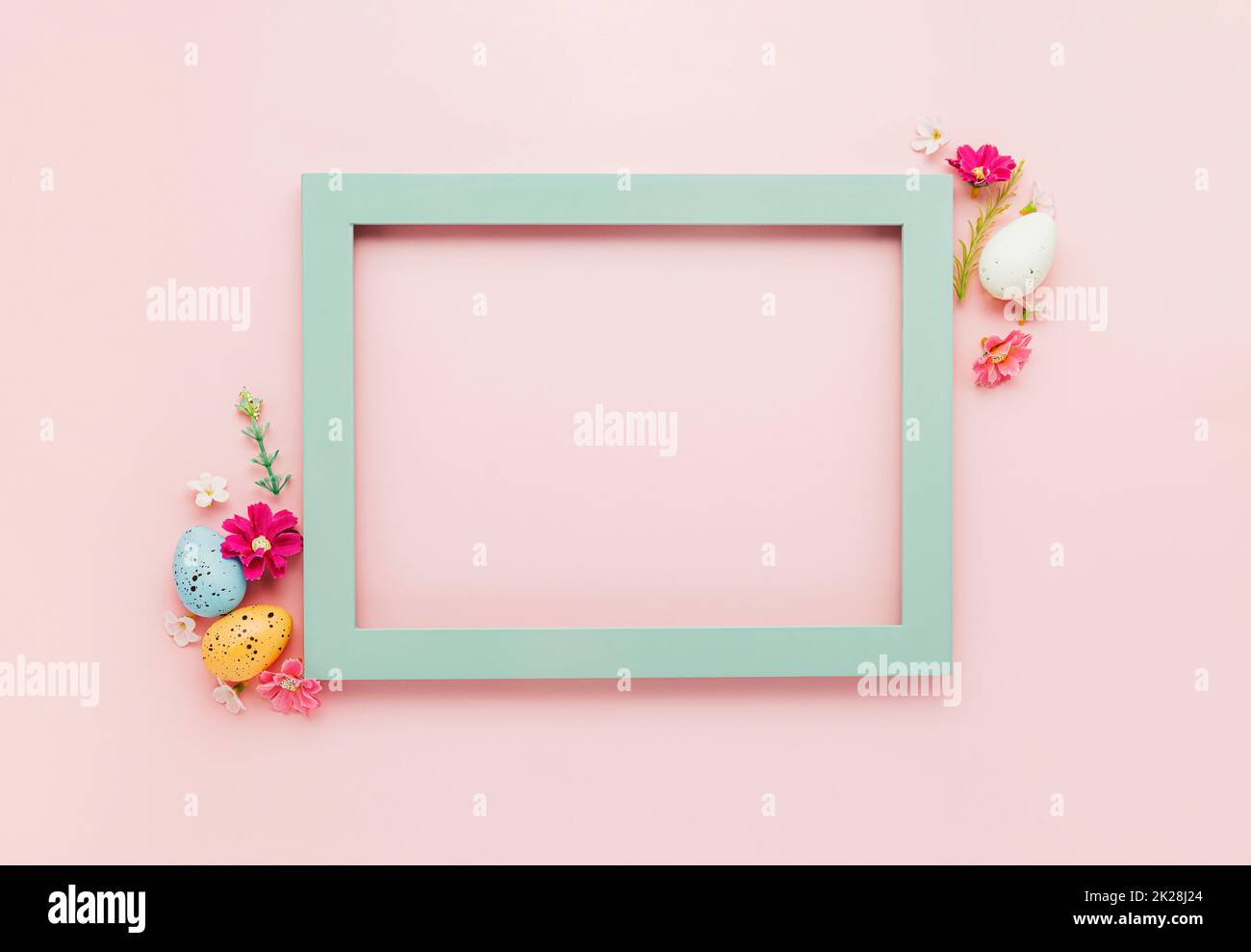 Easter holiday mockup background. Top view from above to Easter eggs with frame Stock Photo