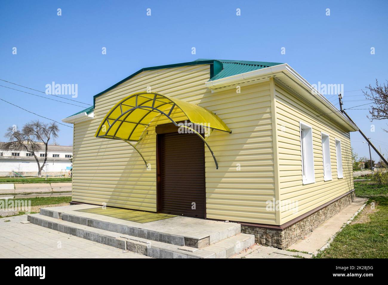 The building shop, lined with plastic siding. Exterior finish. Stock Photo