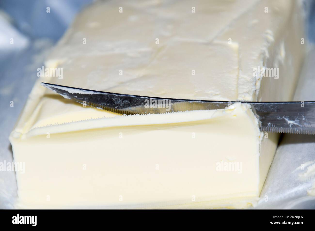 Cutting a butter knife. Butter and knife Stock Photo Alamy