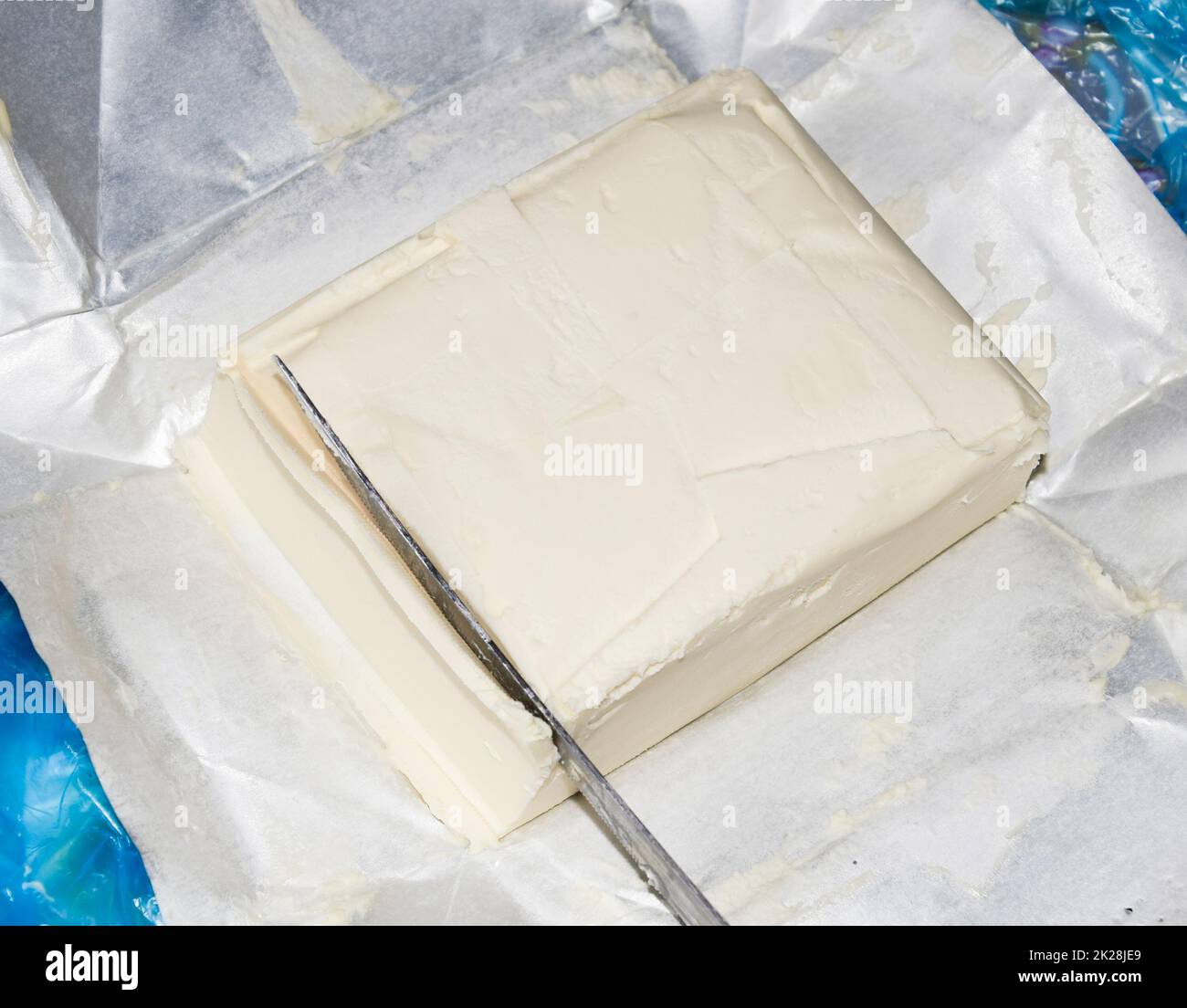 Cutting a butter knife. Butter and knife Stock Photo Alamy