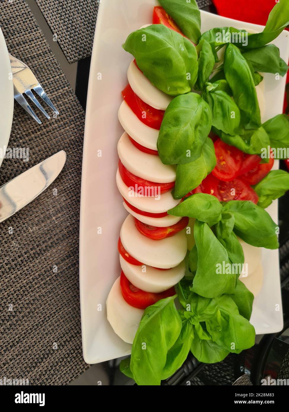 Mozzarella, tomatoes and basil Stock Photo