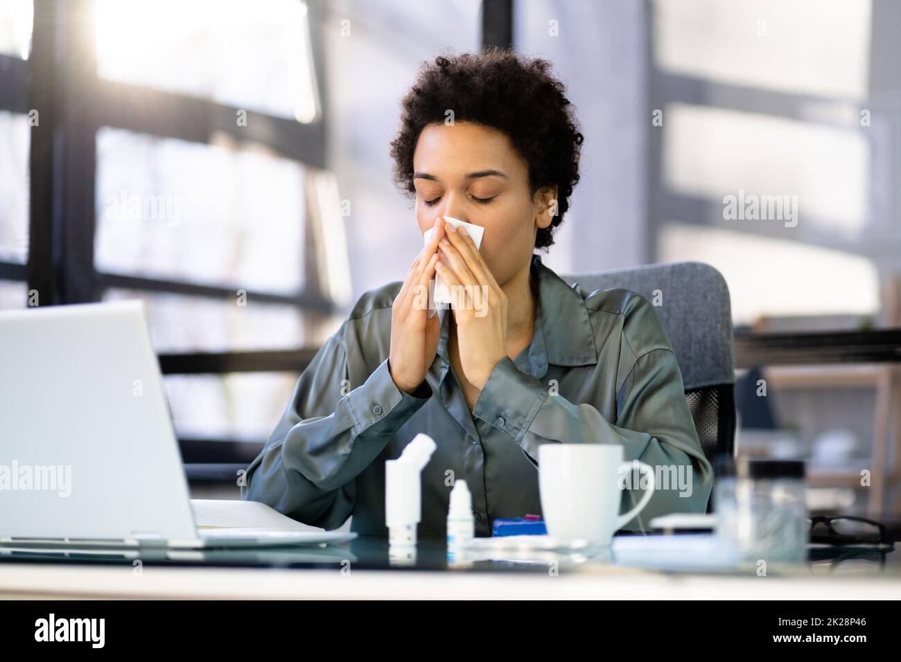 Sick Office Employee Sneeze At Work Stock Photo Alamy