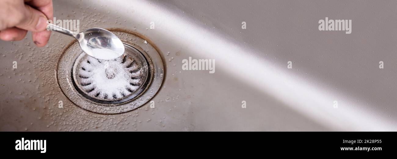 Kitchen Sink Drain Cleaning Using Baking Soda Stock Photo Alamy