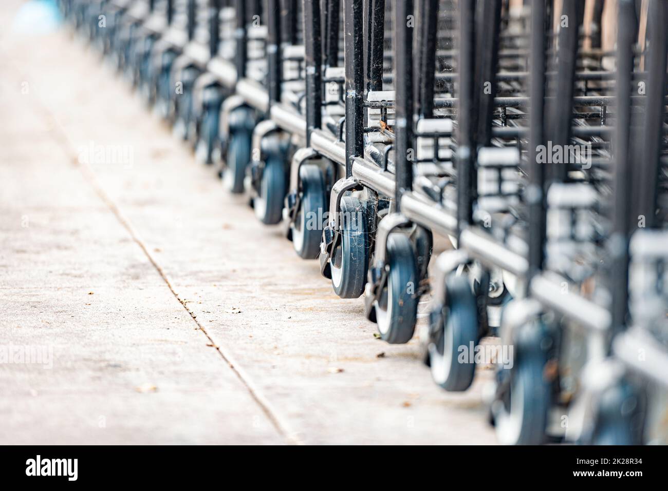 row of shopping carts at supermarket Stock Photo