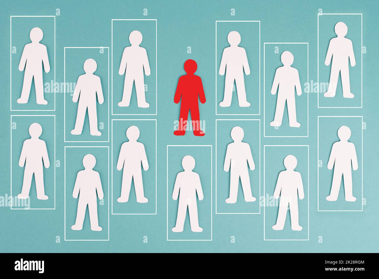 Think outside the box concept, standing out from the crowd, group of people in boxes, one red man has individuality Stock Photo