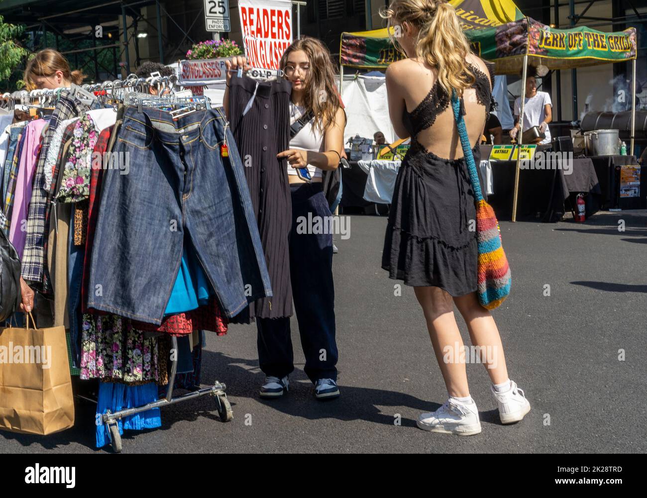 Shoppes browse vintage and used clothing at a late summer street fair in Chelsea in New York on Sunday, September 18, 2022. (© Richard B. Levine) Stock Photo