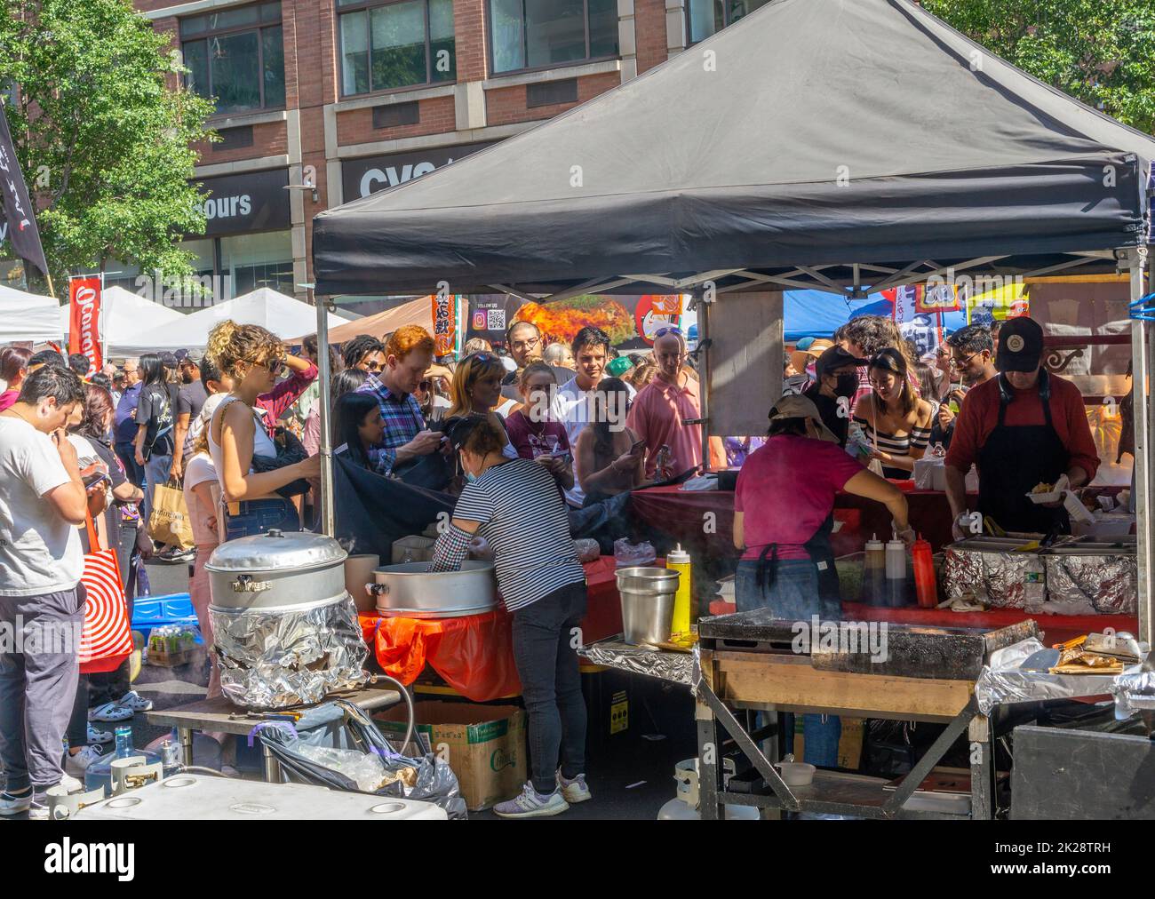 Visitors queue up at a street fair in Chelsea in New York, indulging in Japanese food on Sunday, September 18, 2022. (© Richard B. Levine) Stock Photo