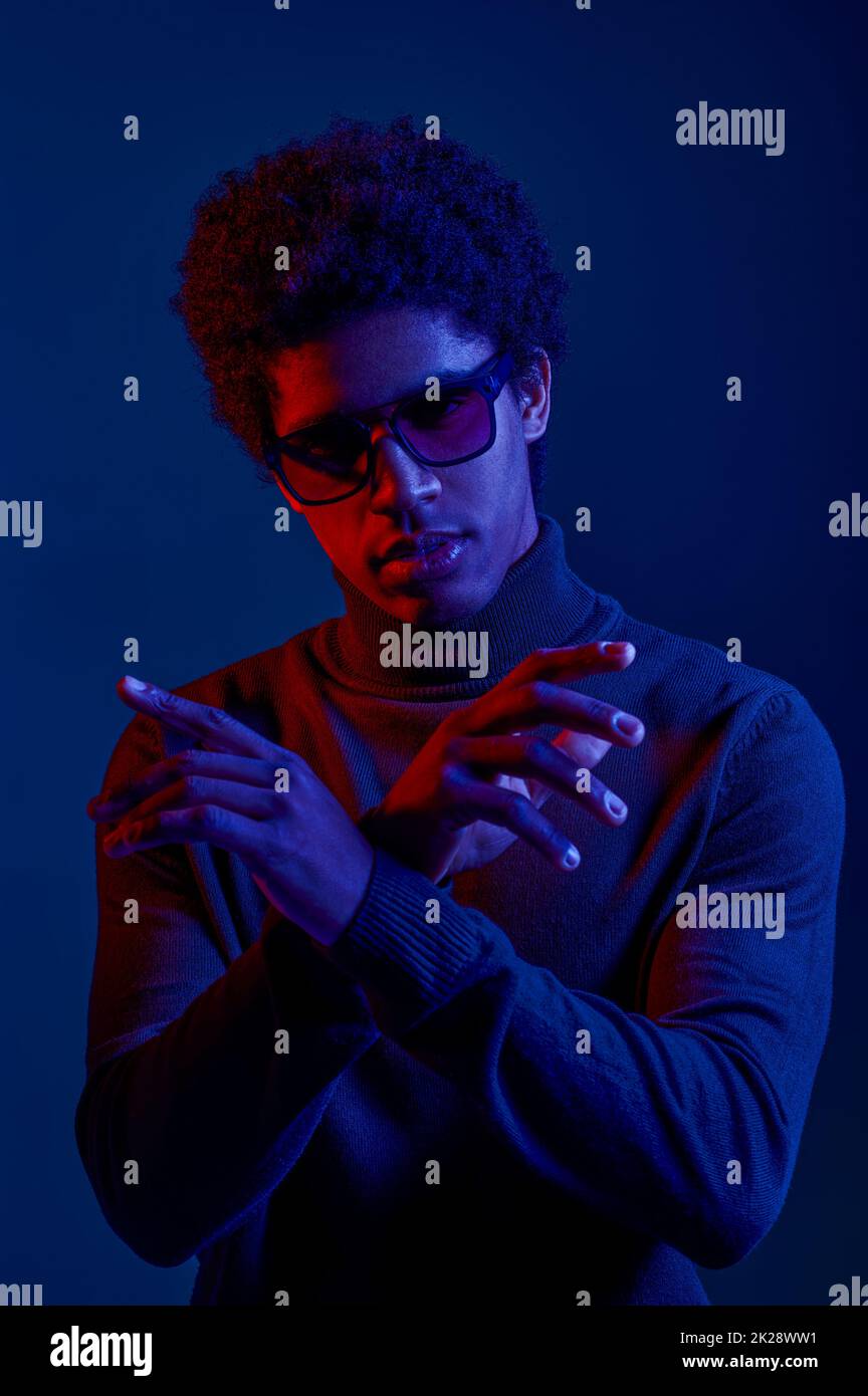 Young confident man posing for camera studio shot Stock Photo