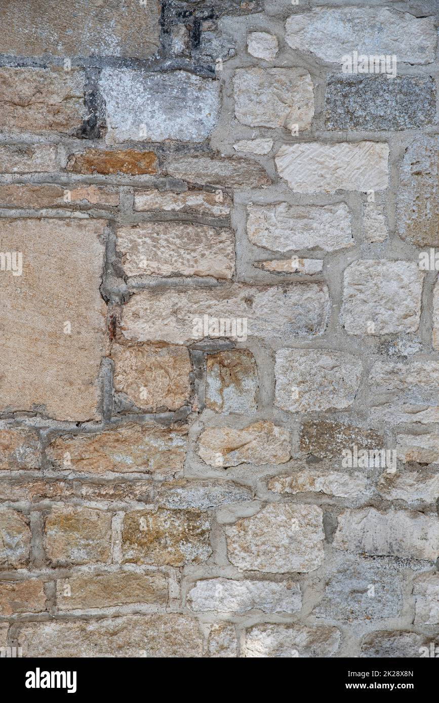 Irregular and brown stone wall texture Stock Photo
