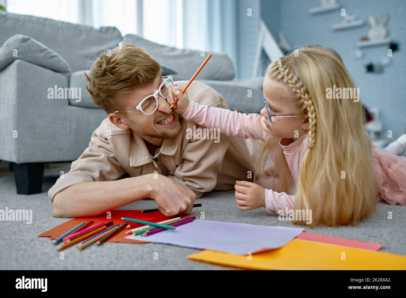 Father and daughter having fun together at home Stock Photo
