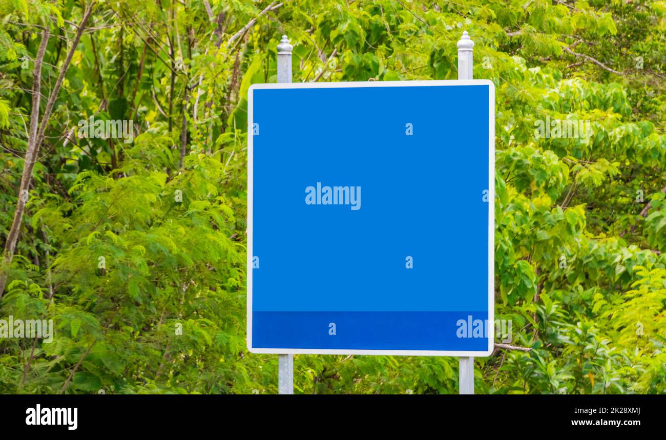 Blank empty blue typical Asian street road sign Phuket Thailand. Stock Photo