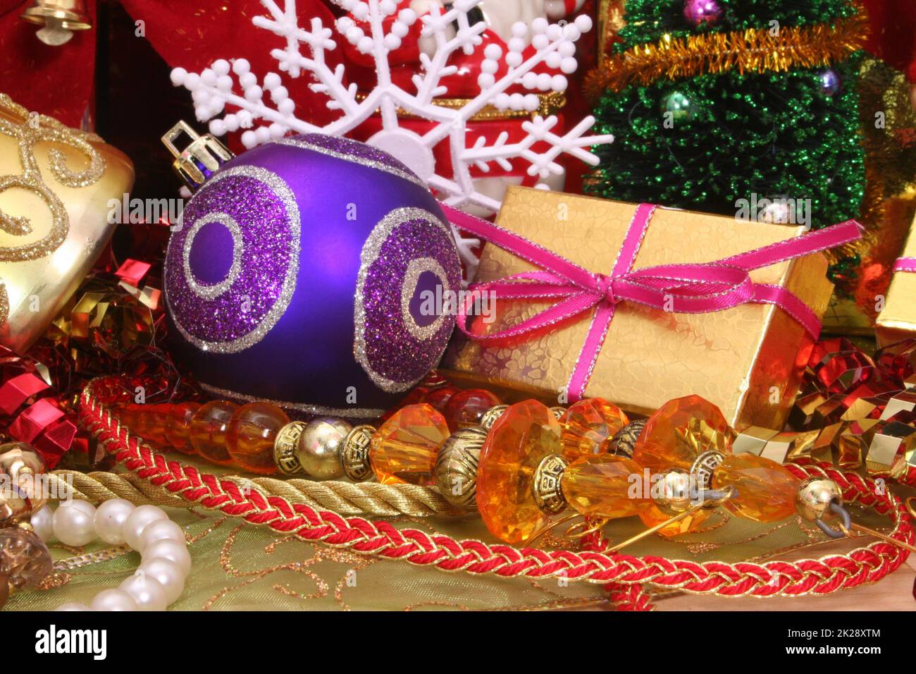 Christmas Decorations Bows, Balls and Beads Close up Stock Photo