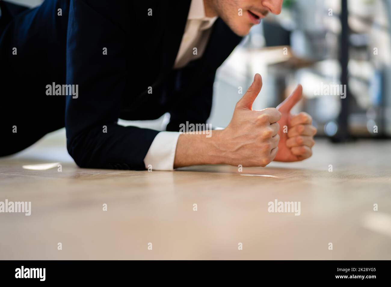Man Doing Office Plank Exercise Workout Stock Photo