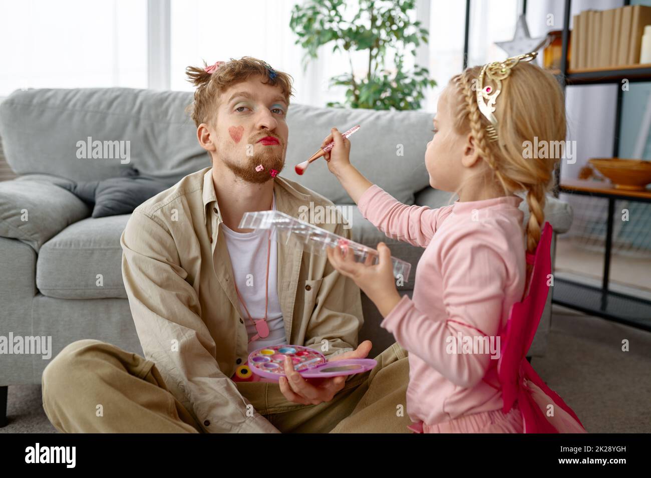 Father spends time with daughter, focus on smiling daughter Stock Photo