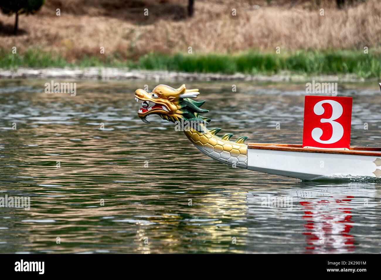 Prow of Traditional Chinese Dragon Boat on a river Stock Photo