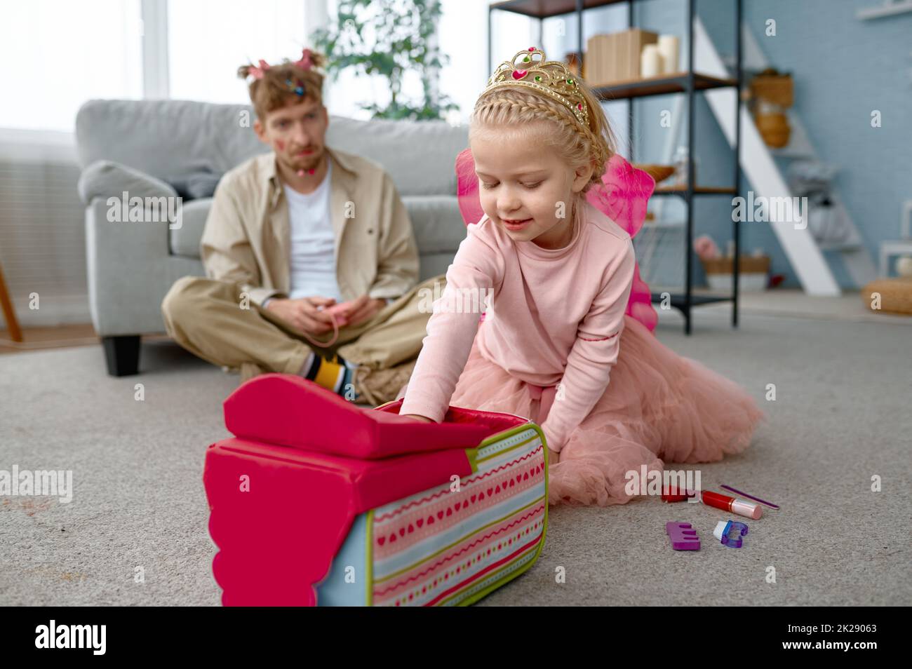 Father and daughter wearing fairies costume having fun Stock Photo