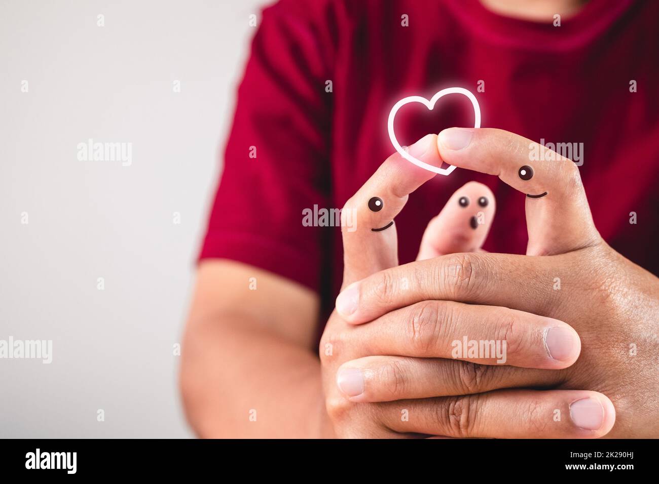 Art of love on Fingers. Hands join together. Kiss on tip of index. Valentine's day concept with copy space. Stock Photo