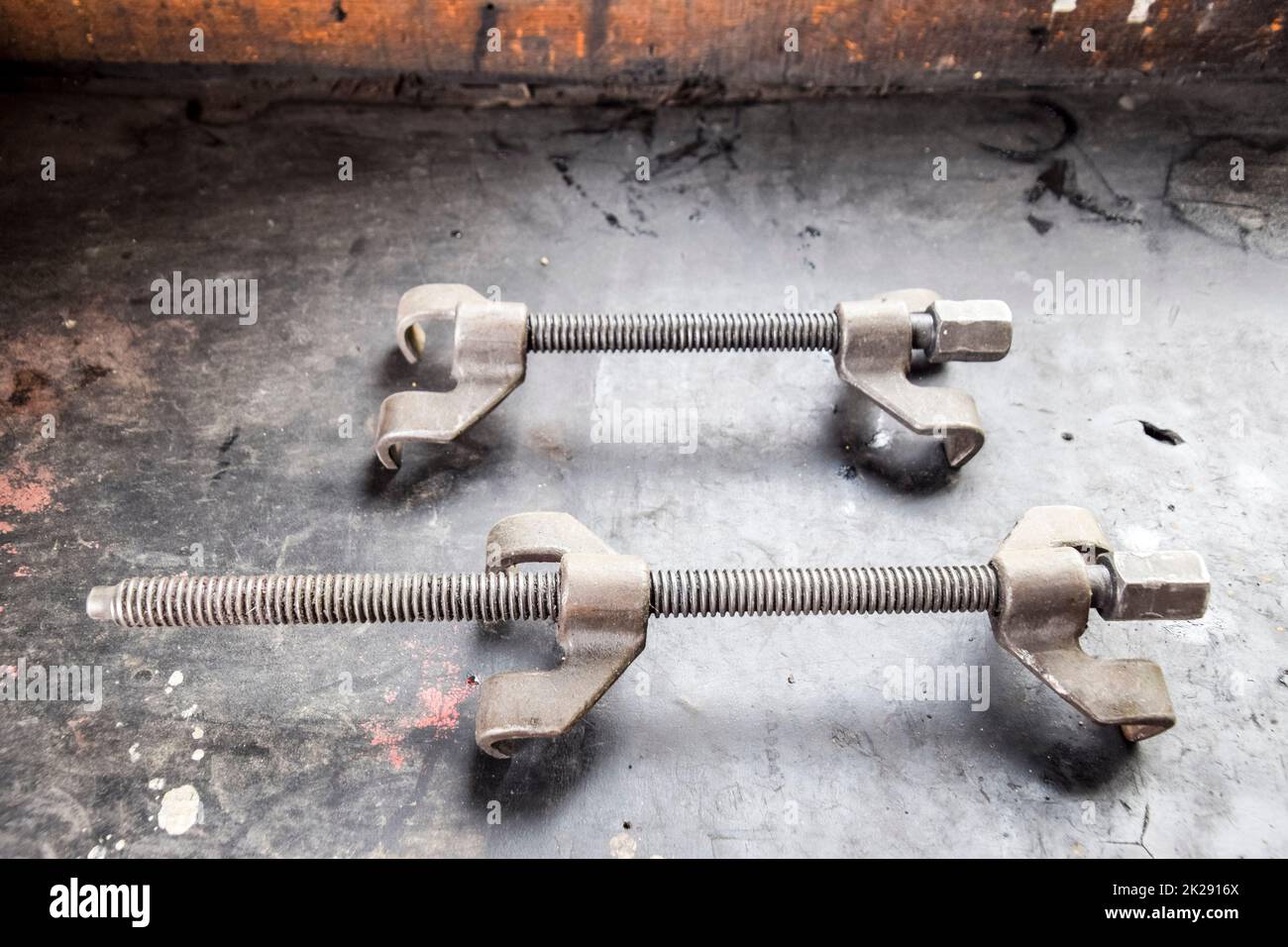 Screws for springs. A device for tightening springs Stock Photo Alamy