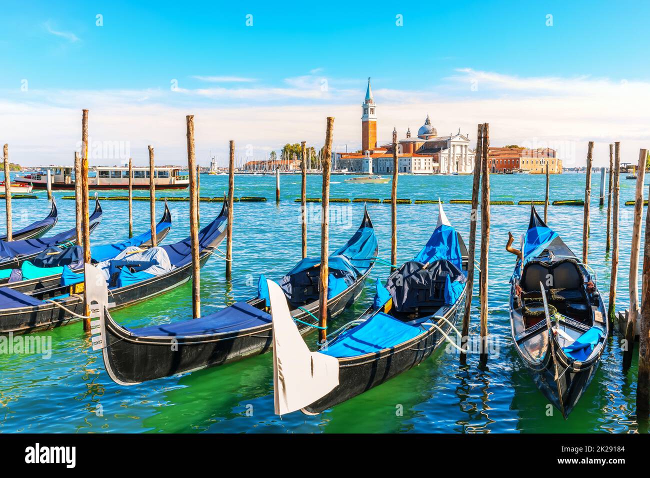 Gondolas moored in the lagoon of Venice not far from San Giorgio Maggiore Island, Italy Stock Photo