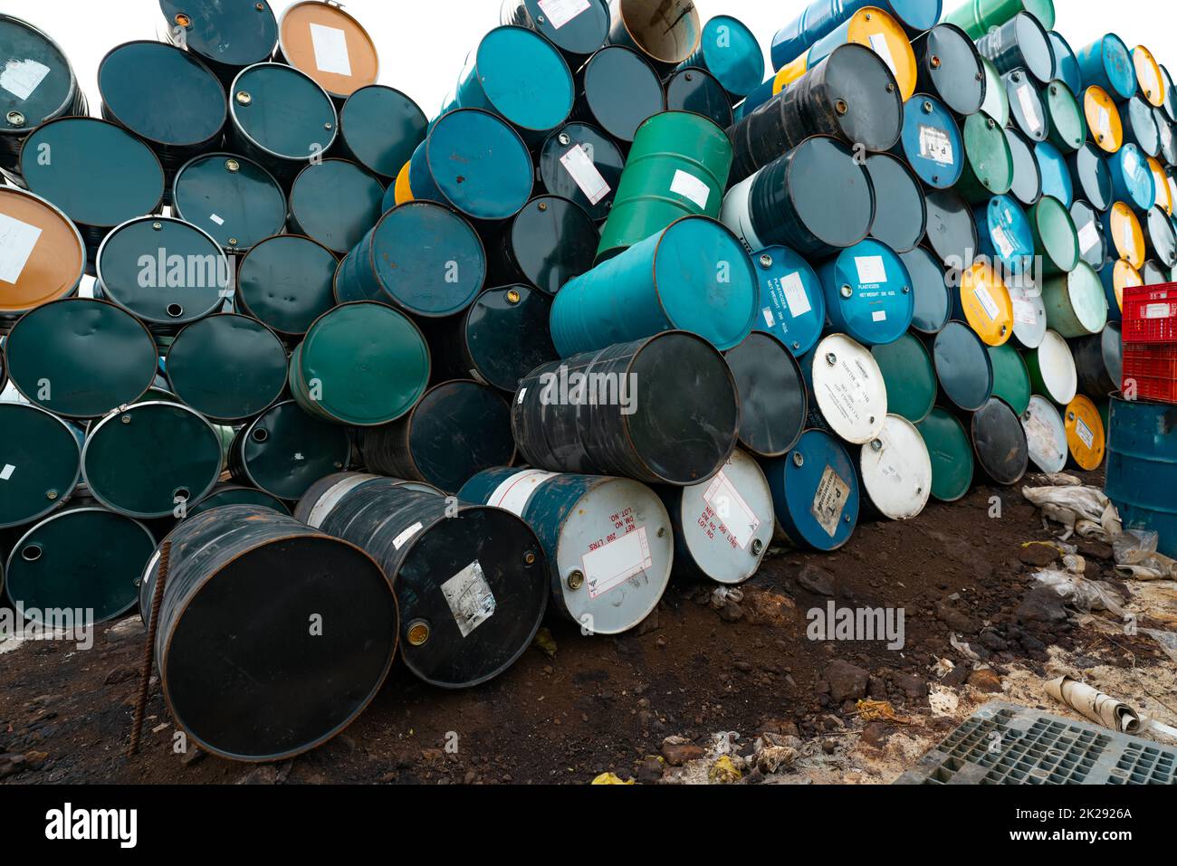 Old chemical barrels. Hazard chemical barrel with warning label. Blue, green, yellow and black