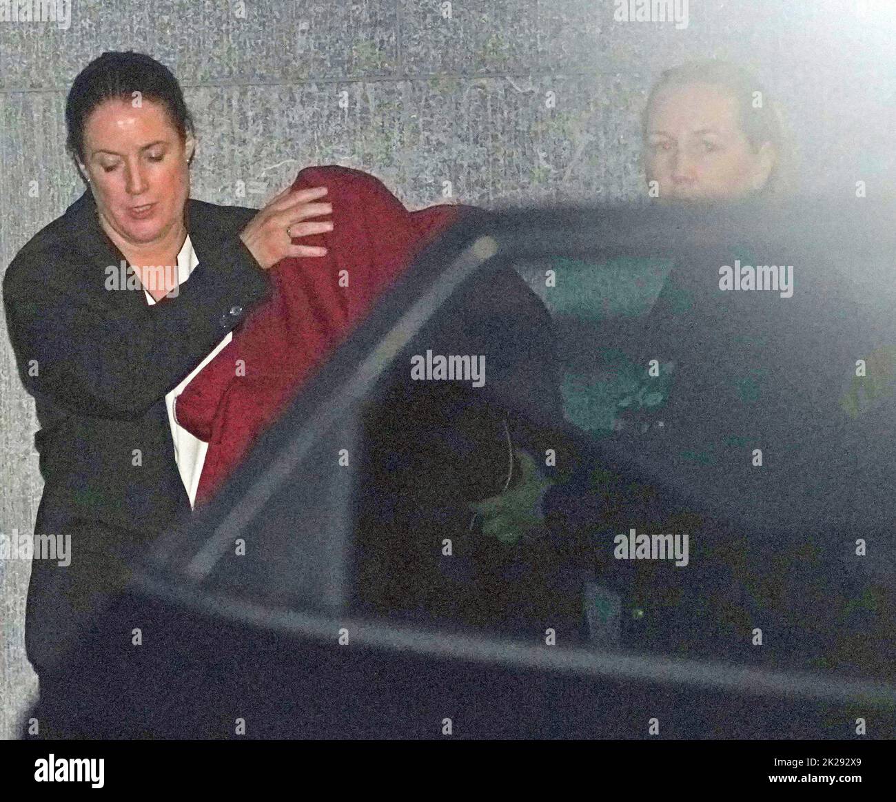 BEST QUALITY AVAILABLE Lynn Egar, 48, (purple hoodie) is led from court after a special sitting of Mullingar District Court, Co Westmeath, where she was charged with the murder of her two children. Picture date: Thursday September 22, 2022. Stock Photo